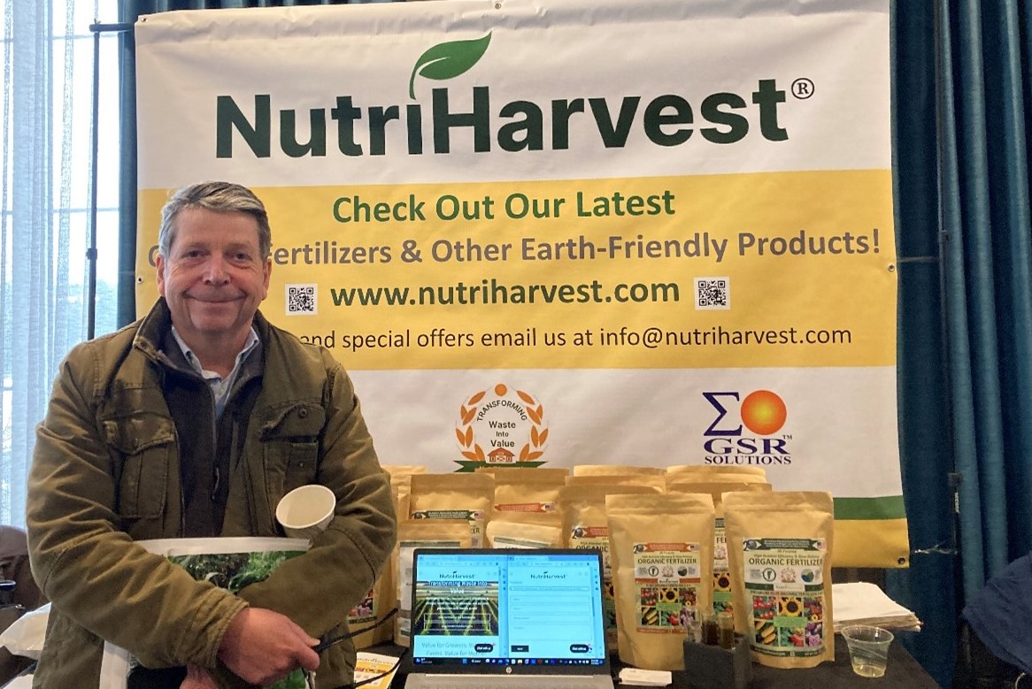 Anson Tebbetts in front of fertilizer products from the Green Mountain Dairy Farm project